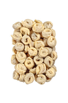 Raw Capelletti seen from above with meat filling on neutral background