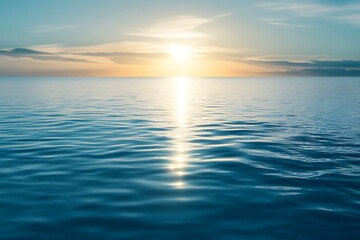 Obraz premium Peaceful sunrise over calm ocean water with sun reflection. Tranquil seascape with sun rays. Horizon