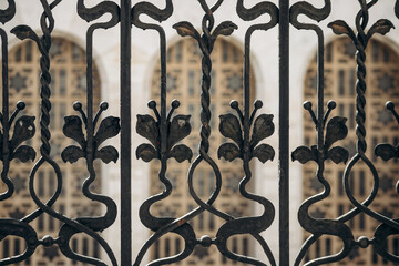 Art Nouveau style wrought iron balcony railing and the Budapest Synagogue in the background.