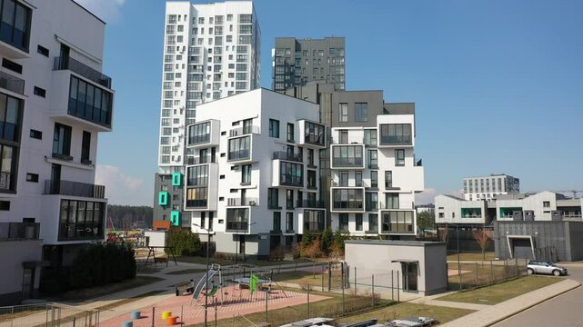 Modern residential neighbourhood, Salvador Dali style house of cubic shape. A house in the style of a paradox. Residential multi-storey building with sharp corners, white and black colours. Modern arc