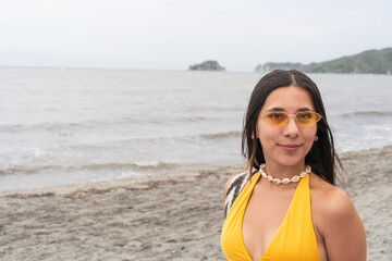 Woman in Yellow Sunglasses Enjoying a Day at the Beach