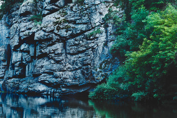 Deep silver canyon with smoothly flowing water