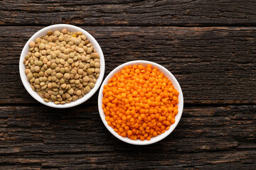 In two bowls with red and brown lentils - Lens culinaris.
