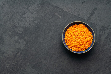 Red lentils in the bowl - Lens culinaris organic.