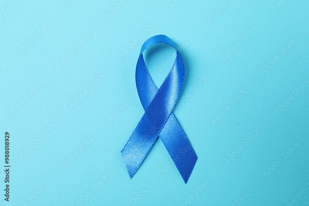 Poster Blue ribbon on color background, top view. Prostate cancer awareness