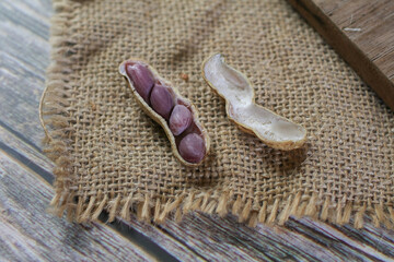 Boil nut on dark background. Groundnut or Arachis hypogaea. Favorite snack at social gatherings eat with drink.