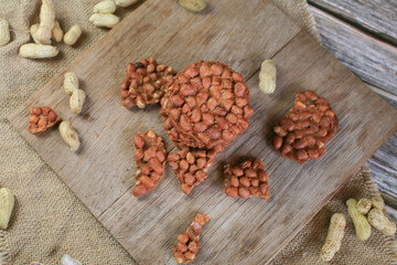 Boil nut with Thai Fried Peanut Cookies on dark background. Deep Fried Bean cookies peanut crackers made from nuts and flour to fry.