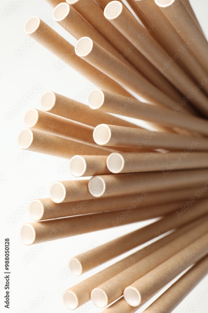 Poster Many bamboo drinking straws on white background, closeup