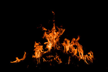 Fire over black background. Fire sparks background. Abstract dark background. Texture of fire on...