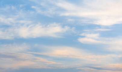 Late afternoon, faint white clouds in the blue sky.
