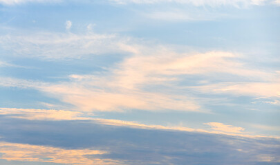 Late afternoon, faint white clouds in the blue sky.