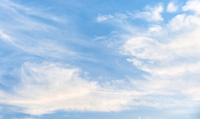 Late afternoon, faint white clouds in the blue sky.