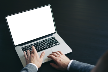 Close up of male hands and laptop with blank screen. Mock-up of computer monitor. Copyspace ready for design or text. Transparent screen, cut out. PNG