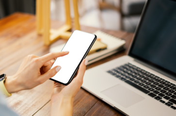 Mockup image of a woman using smartphone with blank screen. Transparent. Cut out. PNG