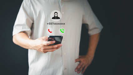 Concept of scam, fraud with a phone from the scammer. Man answering the incoming call. Phone call was from an unknown number. Call center gang or stranger. Hoax person with a fake identity.