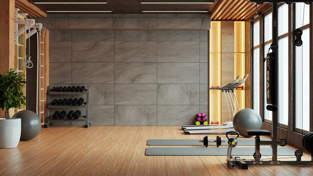 Modern gym interior with sport and fitness equipment on concrete wall background- 3D rendering