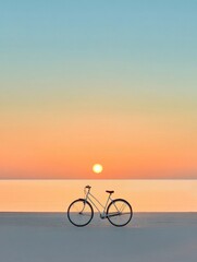 Fototapeta premium A lone bicycle sits on a sandy beach at sunset, symbolizing freedom, adventure, relaxation, tranquility, and the beauty of nature.