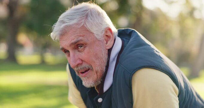 Tired, mature man and breathing in park, runner and exhausted in workout, outdoor and fitness. Nature, fatigue and morning for exercise of elderly person, performance and practice for marathon
