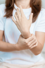 Woman having wrist pain at home, muscle ache due to De Quervain s tenosynovitis, ergonomic, Carpal...