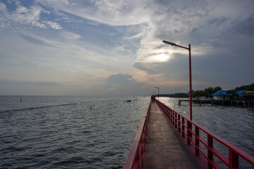 Evening atmosphere along the river on the red bridge.