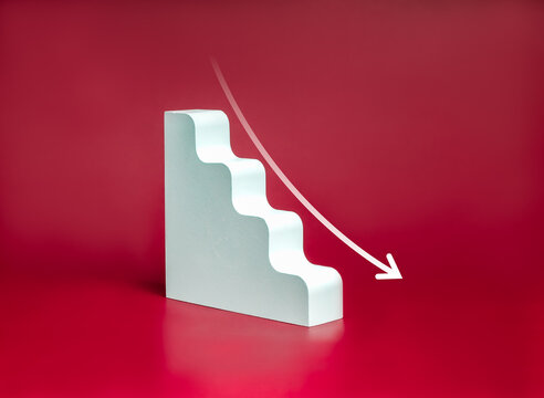 Down arrow on white geometric stairway, decrease business graph down step, finance diagram on red background. Financial crisis, bankruptcy, loss investment economic recession sales risk concepts.