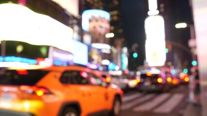 New York City Times Square, Manhattan Midtown Broadway street, USA. American NYC yellow taxi cab, urban road traffic. People. Advertising signs, commercial ads, illuminated billboard screens glowing.