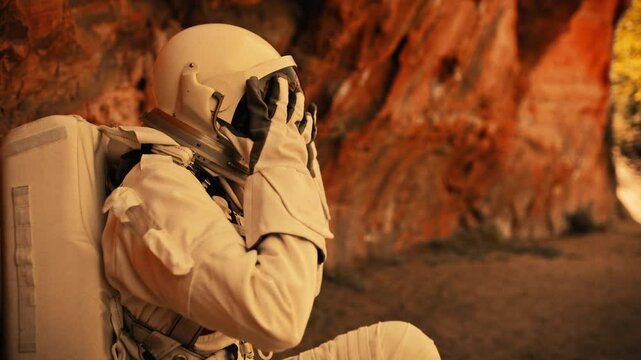 Woman astronaut explores Martian landscape in futuristic space suit
