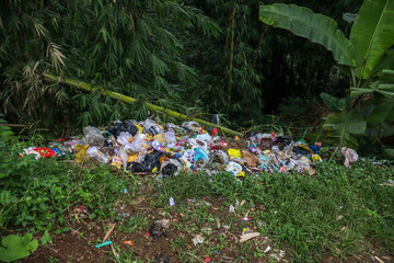 Piles of rubbish dumped in rice fields and bamboo forests, an irresponsible act, trash, garbage