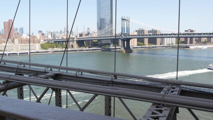 New York City Manhattan Bridge from Brooklyn Bridge view. USA travel landmark, NYC skyline...