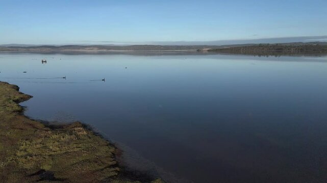 Moulting lagoon in coles bay with mudflats scattered, tasmania, australia, aerial orbital