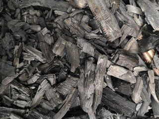 Wood chips, wood charcoal, old wood charcoal that has been burned to black, black wood charcoal.