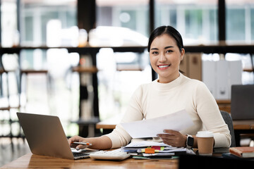 Portrait, office and woman with laptop, confidence for consulting,  financial administration and happy smile at desk