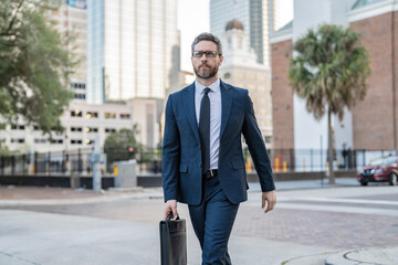 Businessman in suit walk outdoor. Walk to success. Businessman walk in the city. Business man crossing the street. Walk of business man. Businessman in New York. Business success