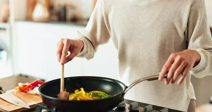 Woman, hands and cooking in kitchen with aroma, vegetables and stirring food in pan. Nutritionist, culinary skills and smelling dish in home for recipe, nutrition and stir fry meal prep for wellness
