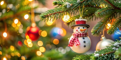 Obraz premium Snowman ornament hanging on a Christmas tree , snowman, ornament, Christmas tree, holiday, decoration, festive, winter, season
