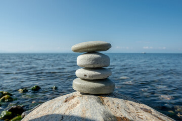 Handmade craft soap in the shape of stones on the seashore or lake. The image of organic cosmetics in the natural environment