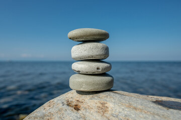 Handmade craft soap in the shape of stones on the seashore or lake. The image of organic cosmetics in the natural environment