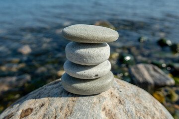 Handmade craft soap in the shape of stones on the seashore or lake. The image of organic cosmetics in the natural environment