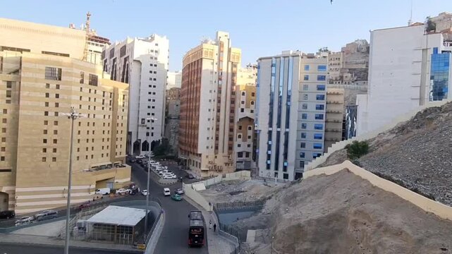 Mecca, Saudi Arabia on February 29, 2024. A road near the Grand Mosque, near several hotels or accommodation for Hajj or Umrah pilgrims so that many buses, cars and taxis pass by on the road.