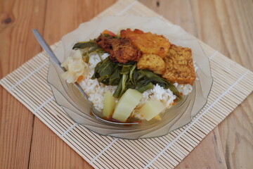 Nutritious plate of food featuring rice and assorted vegetables, a balanced and delicious dish