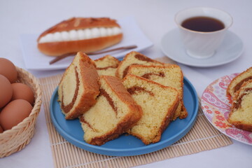 sponge cake on a blue plate with beautiful decoration