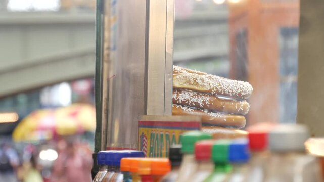 New York City life, Manhattan Midtown 42 street. Fast food hot dog, street food kiosk. Defocused people pedestrian near Grand Central Terminal Station, Pershing Square Bridge USA. Precel, hotdog to go
