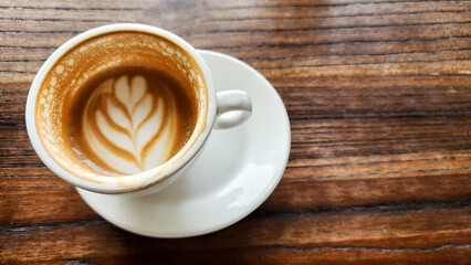 Top view latte art coffee on wood background