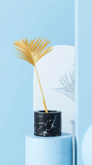 Gold palm leaf in a black marble pot on a blue background