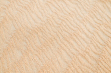 Sand with natural pattern. Beach sand background with natural wave pattern