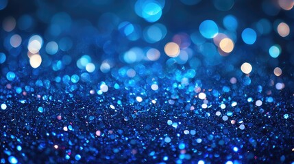 Blue sequin background featuring holiday themed abstract glitter with sparkling lights Brightly colored fabric sequins create a defocused fashion look