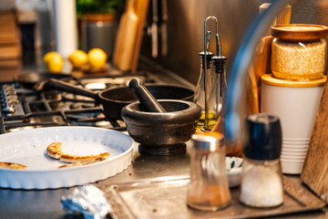 Messy kitchen after home party. Real estate interior.