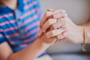Mother, child and holding hands with son for support, trust or love for childhood, empathy or...