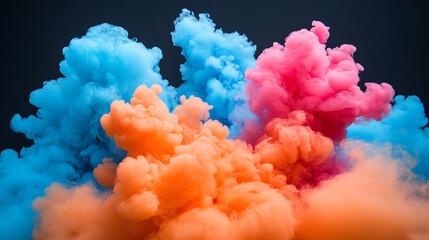 Fototapeta premium Vibrant colored smoke clouds in blue, pink, and orange create a dynamic and energetic visual perfect for creative projects.
