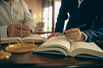 Business and lawyers discussing contract papers and juristic in office law legal services advice justice.